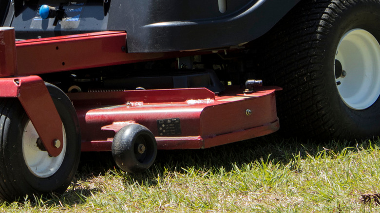 A closeup of lawn mower deck wheels