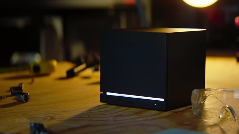 Steam Machine displayed on a wooden surface.