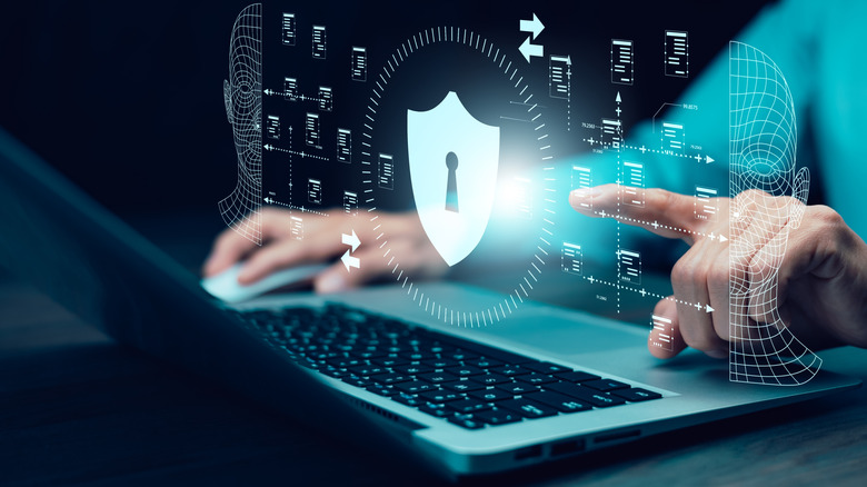 An illustration above an open laptop showing facial recognition software at work