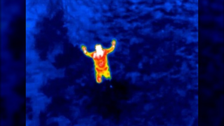 A thermal image of a person captured by a drone camera.