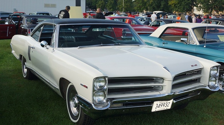 Front 3/4 view of a white 1965 2+2