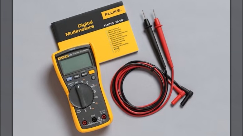 The Fluke 117 Electrician's Digital Multimeter from Lowe's comes with a user manual and test leads.
