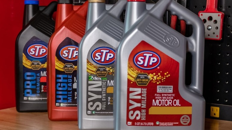 Four bottles of motor oil in various colors