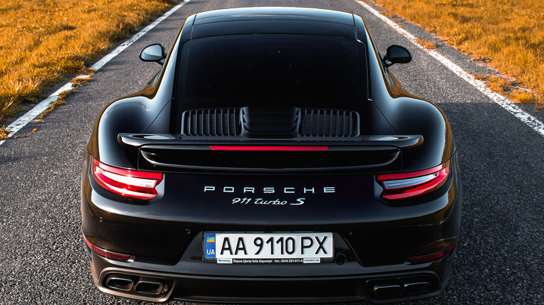 Black Porsche 911 Turbo S driving