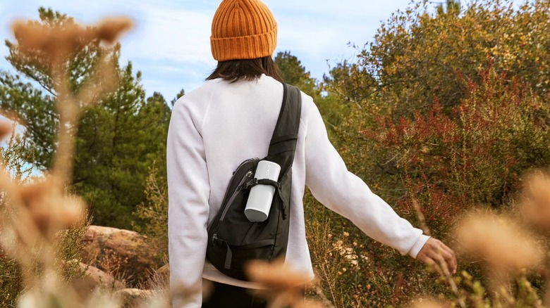 Sonos Roam 2 on a hiker's backpack