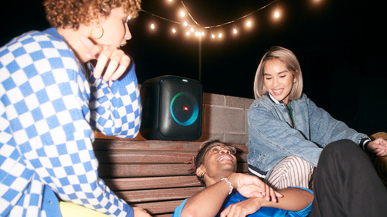 JBL PartyBox Encore Essential in use at an outdoor party