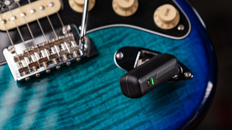 Spark Neo wireless transmitter plugged into a blue Fender Stratocaster.