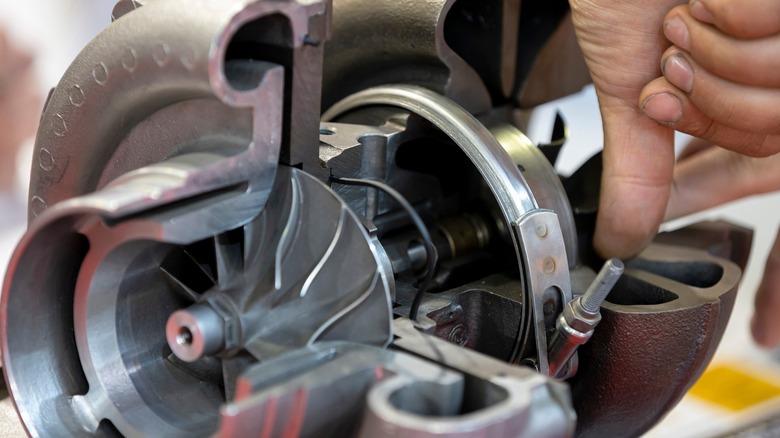 person working on modern turbocharger