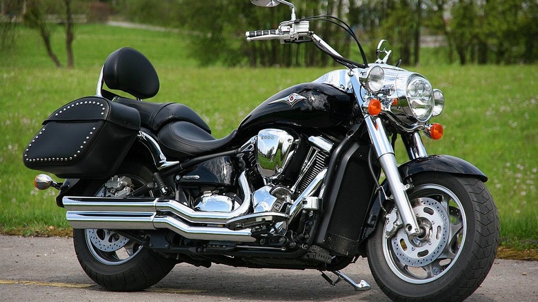 Kawasaki Vulcan 2000 parked in front of grass
