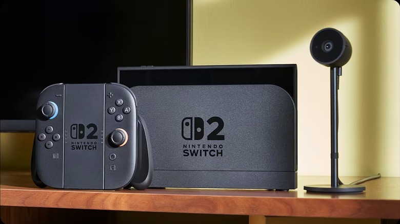 Nintendo Switch 2 with camera docked next to a TV