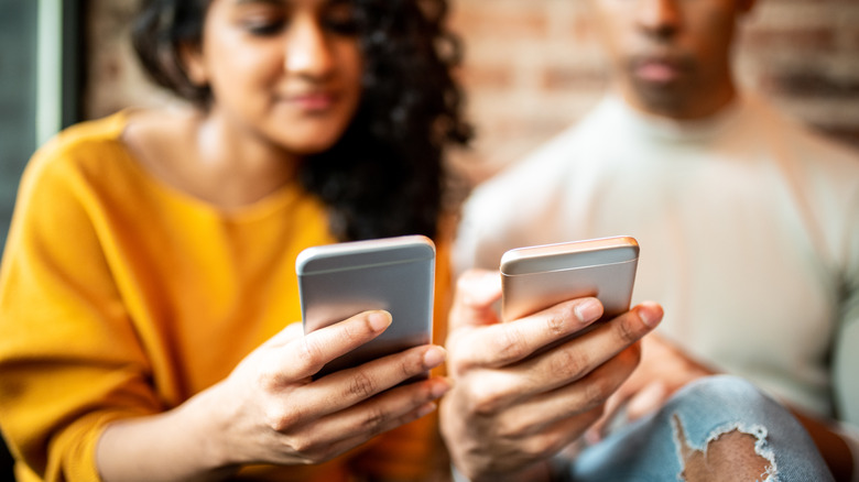 people holding smartphones