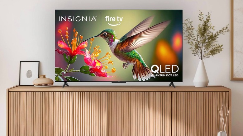 Insignia 55-inch Class QF Series LED 4K UHD QLED Smart Fire TV with Alexa Voice Remote set up in a room