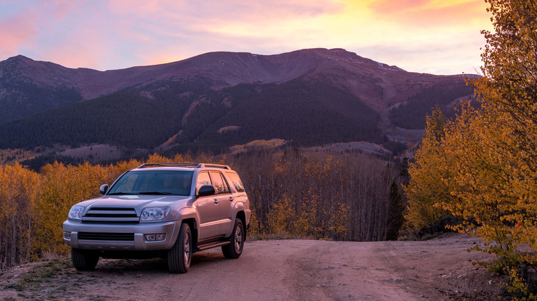 An SUV exploring on a dirt backcountry road