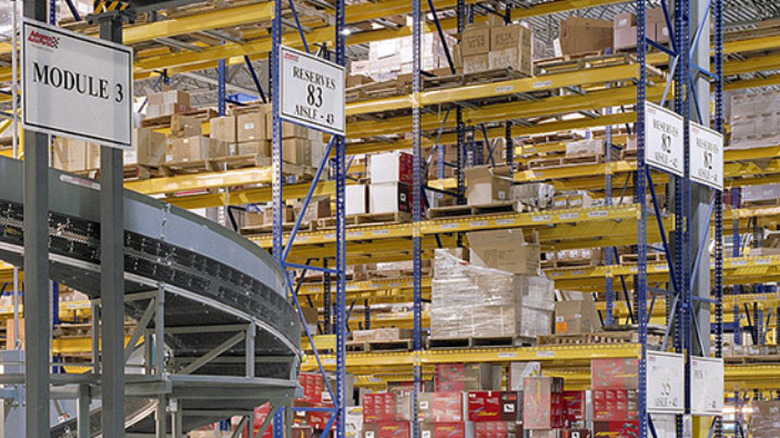Inside of a warehouse with lots of shelves and boxes