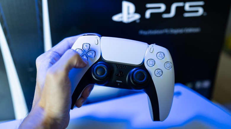 PS5 DualSense controller being held