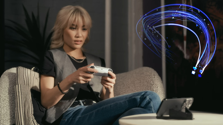 A person playing PS games on a smartphone through Remote Play.