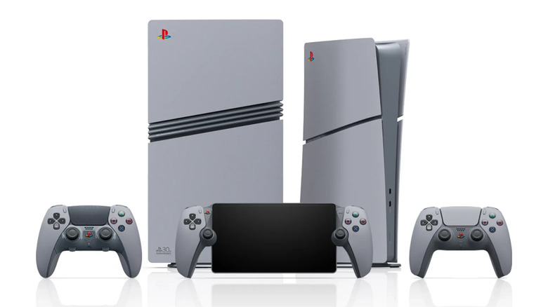 Two gray special edition 30th anniversary limited PlayStations (a Ps5 and Ps4) plus two dual sense controllers and a PS Portal.