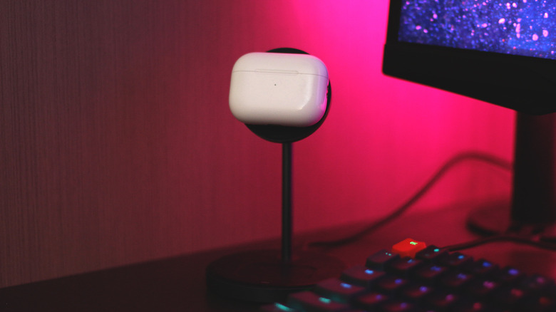 AirPods case magnetically charging on a stand