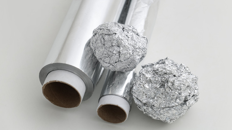 Aluminum balls and foil roll kept on a table