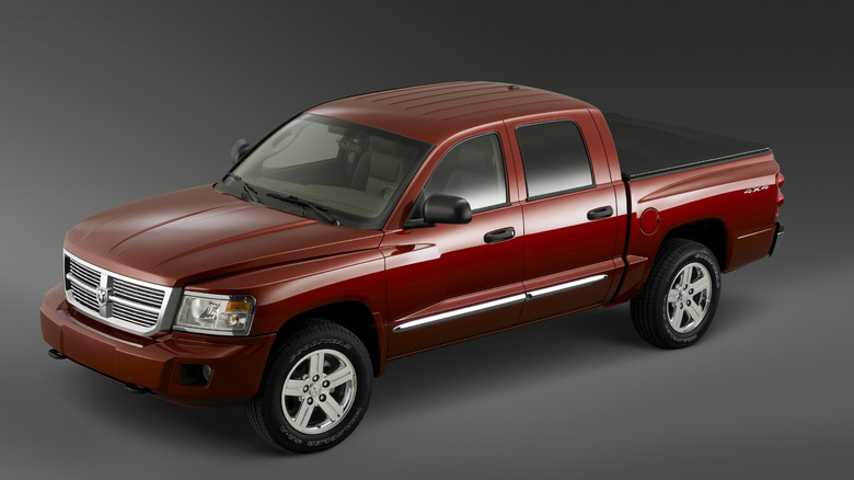 Front 3/4 view of the final generation Dodge Dakota in red, studio shot