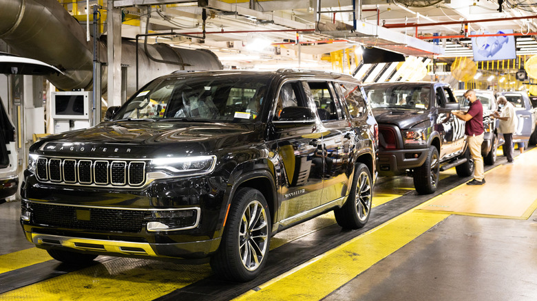 Production line at Stellantis Warren Truck plant showing Jeep Wagoneer and Ram 1500 Classic coming off of line in 2021