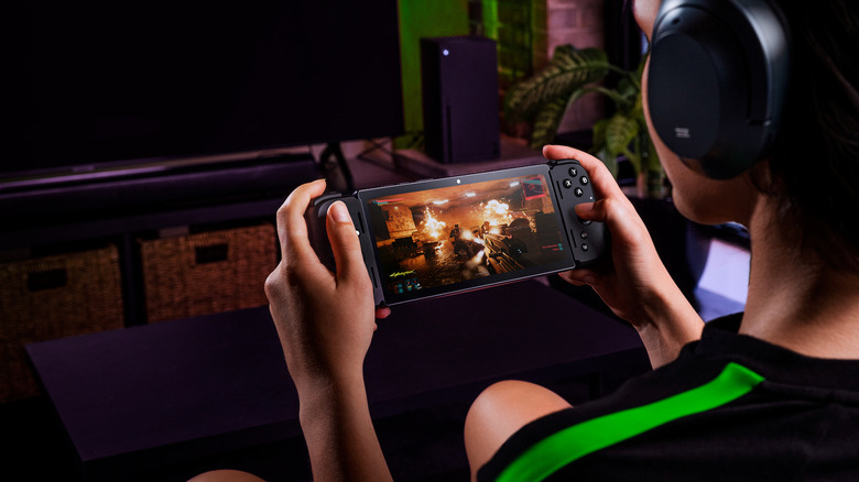 Person playing Razer Edge handheld