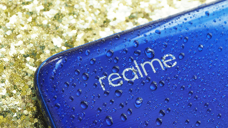 The wet rear panel of a Realme device