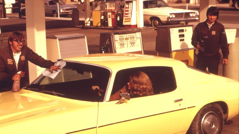 car at 60's gas station