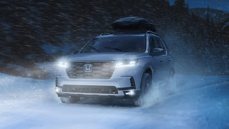 2020 Honda Pilot driving through the snow