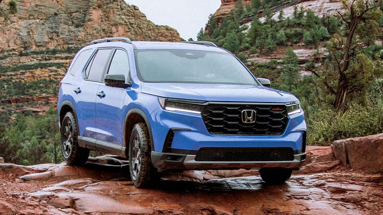 Blue 2025 Honda Pilot on a cliffside