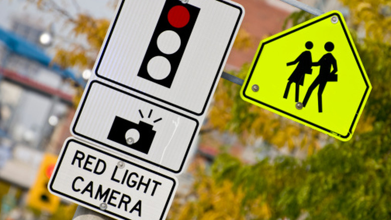 Red light camera sign at crosswalk