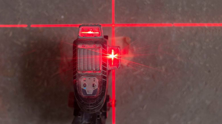Red laser level projecting on a wall