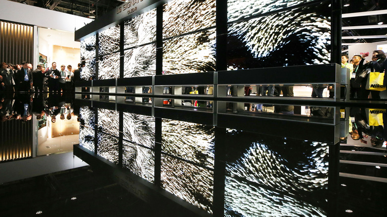 An array of TVs at display at an electronics show