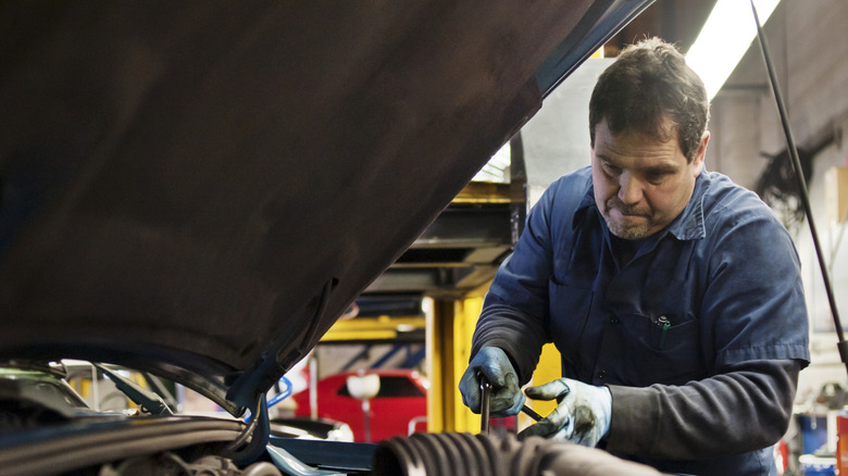a mechanic working on car