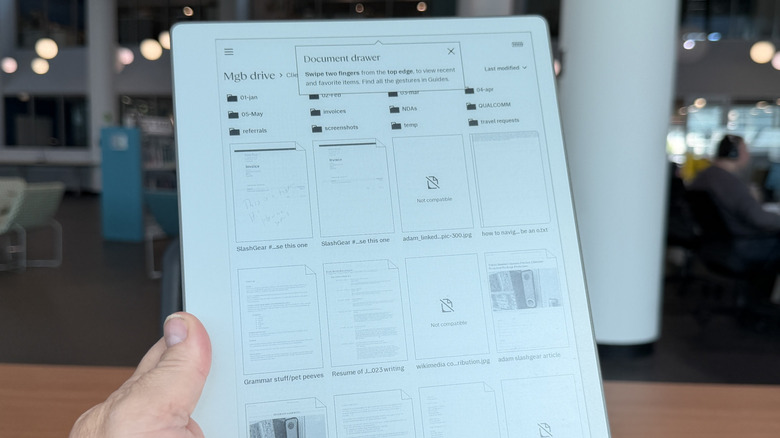 Man holding a Remarkable Paper Pure