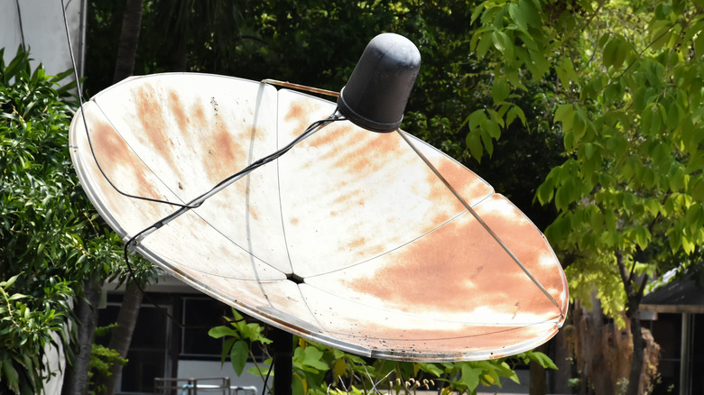 old satellite dish in yard