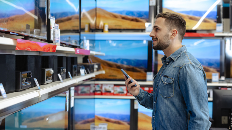 Man shopping for a new TV