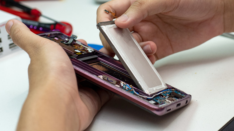 Man repairing a smartphone