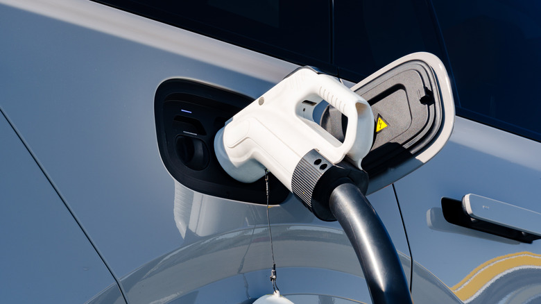 Fast charger plugged into white EV power socket