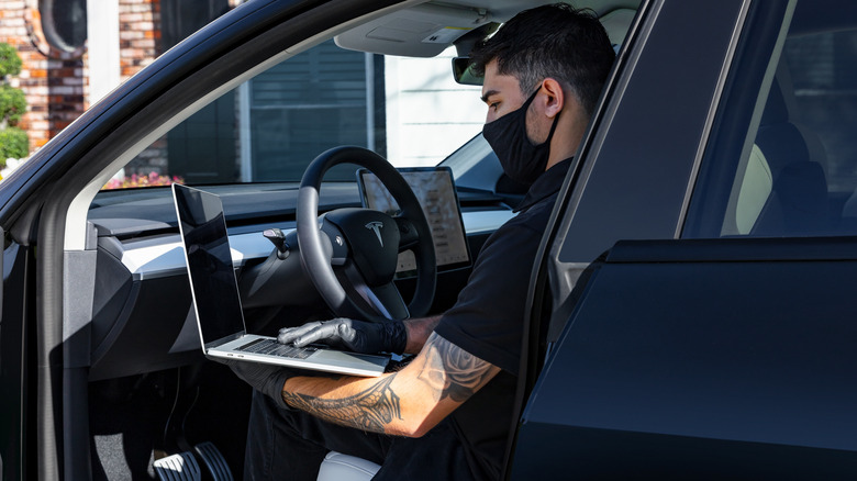 Tesla official service inspects a Tesla