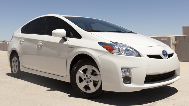 white toyota prius parked garage