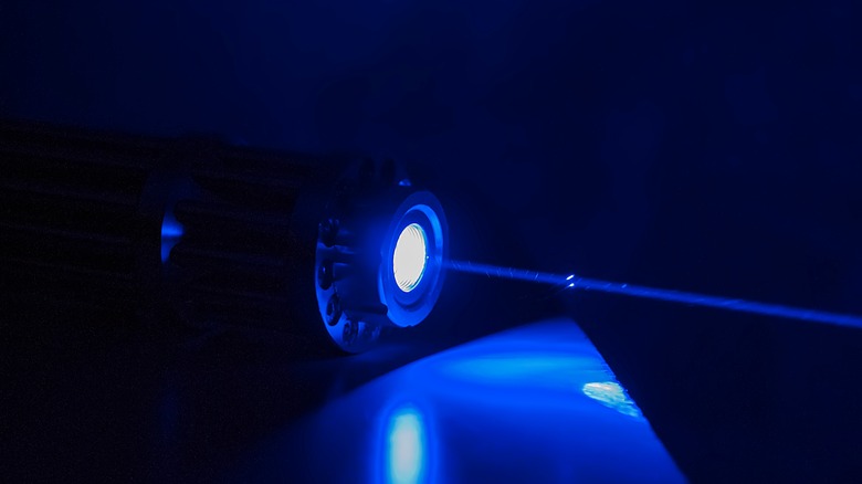 Blue laser dark background