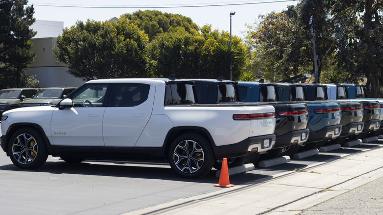 Rivian trucks in a parking lot