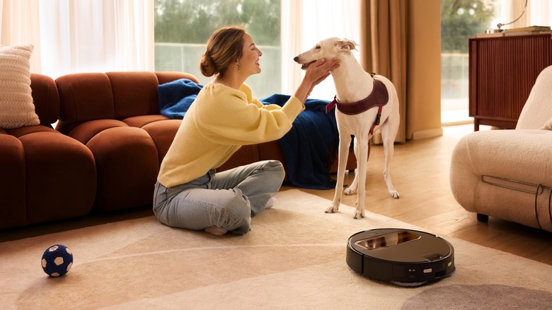 Roborock Saros Z70 with owner and dog