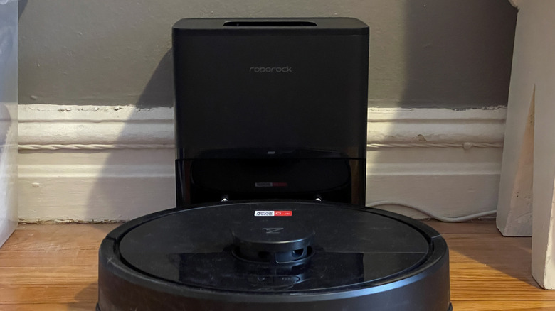 Roborock Q7 M5+ resting in its charging dock.