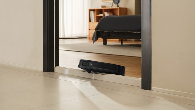 The Roborock Saros 10R navigating over a threshold