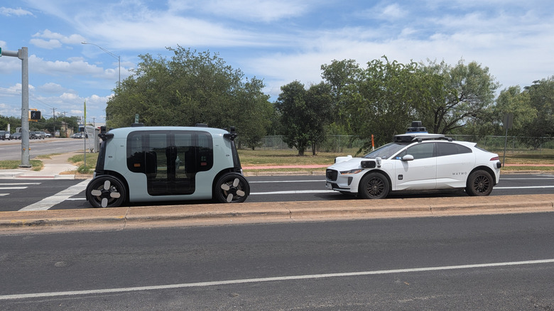 zoox and waymo in street