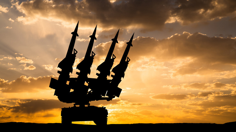 Anti-aircraft missiles with a setting sun in the background