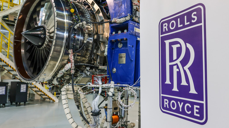 A Rolls-Royce jet engine with the company logo in foreground
