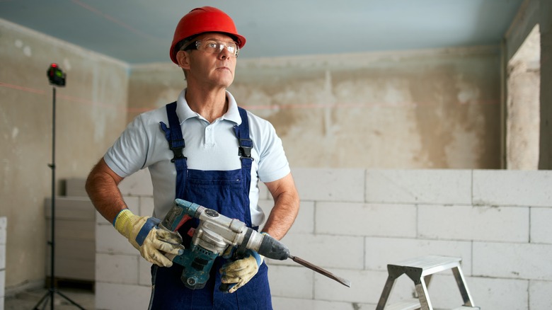 Construction worker with rotary hammer